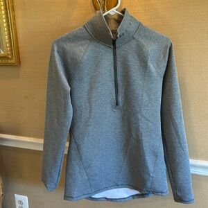 Under Armour Cold gear quarter zip with thumb holes.